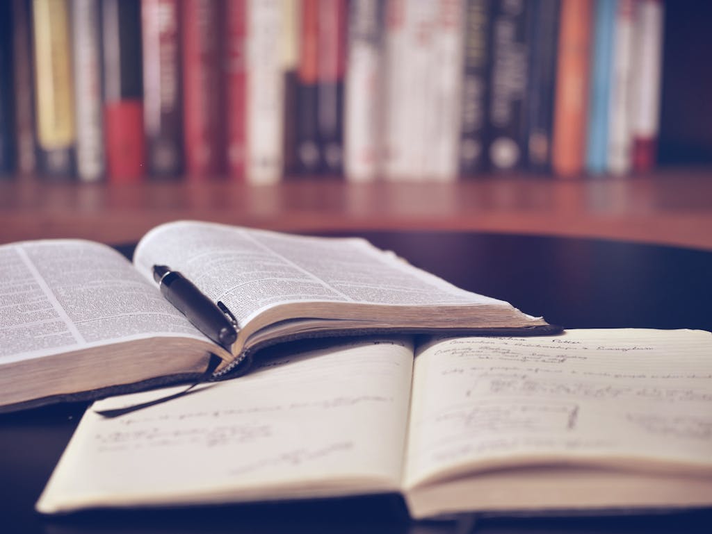 Open book with pen resting in the middle