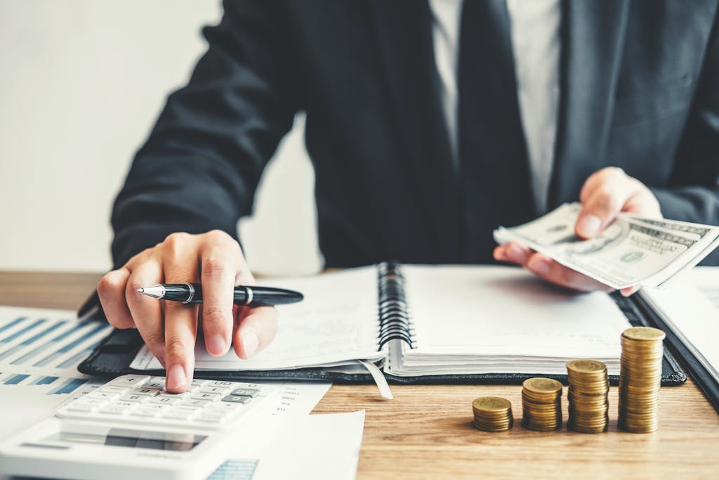 Business man calculating the cost of an LLC