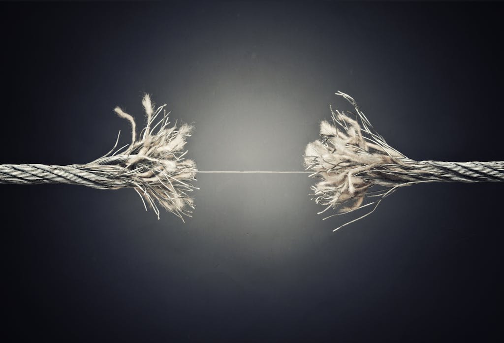 A piece of string being pulled apart